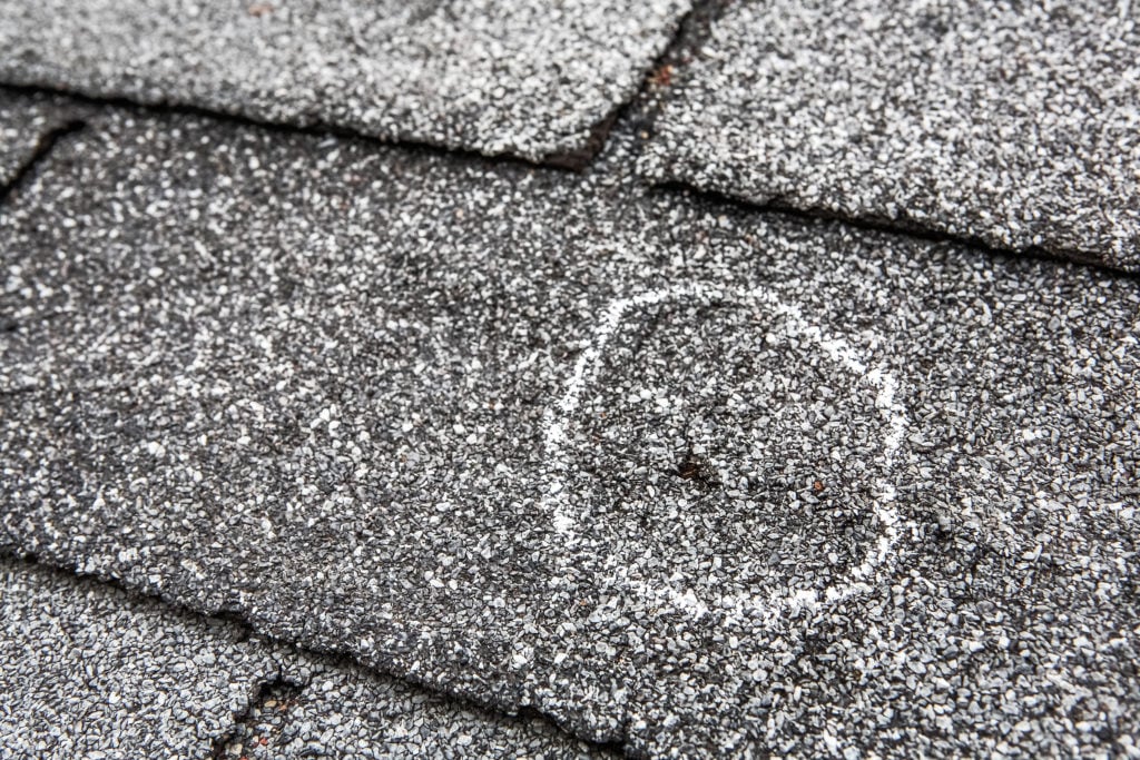 what does hail damage look like on a roof circled for insurance