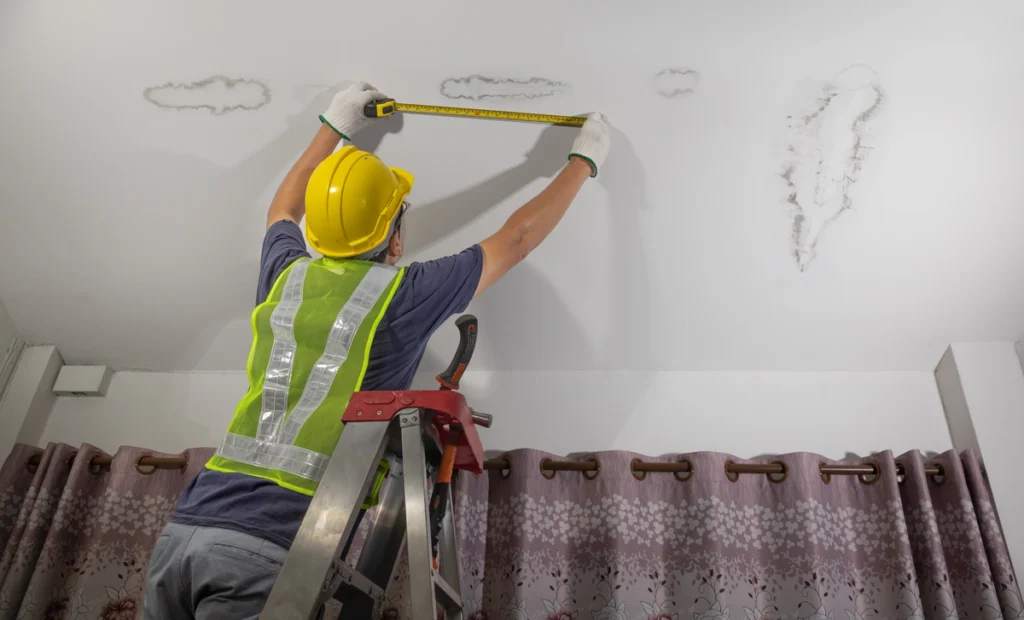 measuring internal ceiling of home for emergency roof leak repair