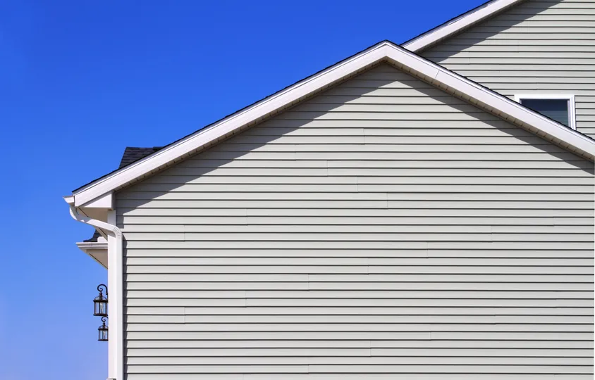 Beige siding on a new house in Maple Grove