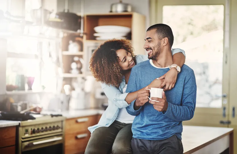 Happy homeowners in Coon Rapids inside their kitchen