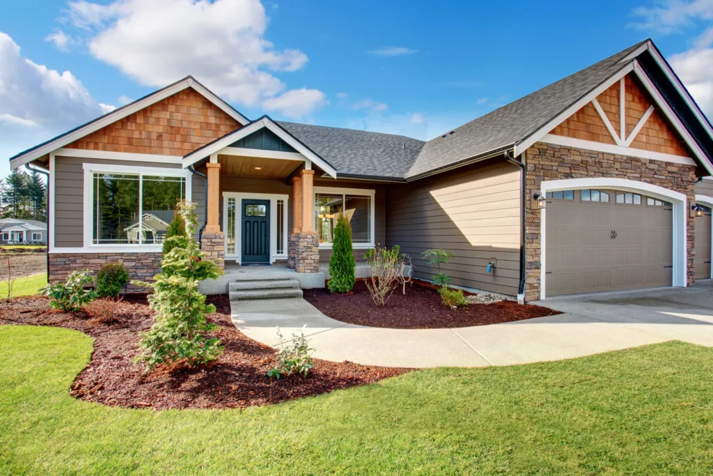 Light brown house with a sidewalk in Hudson