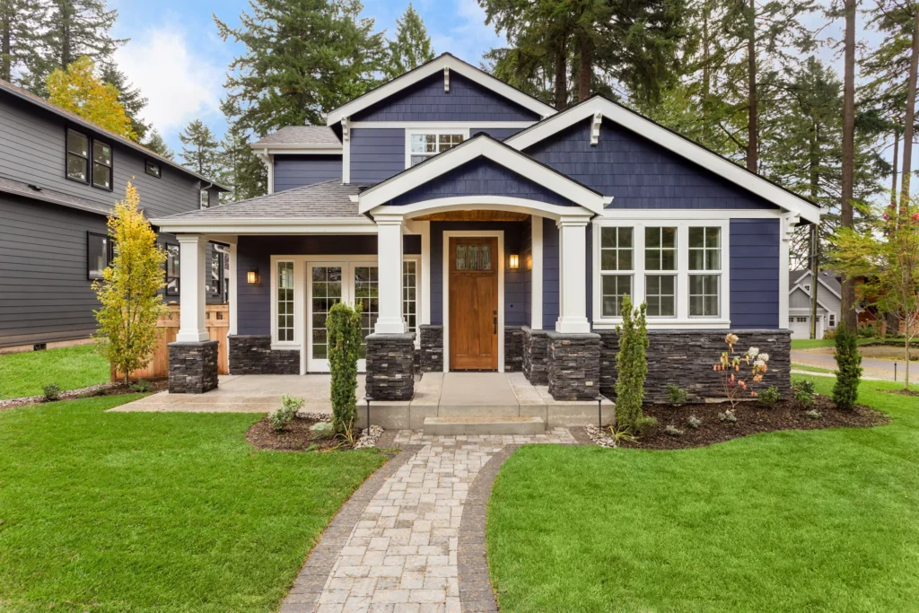 Dark blue house with a wood door in Edina