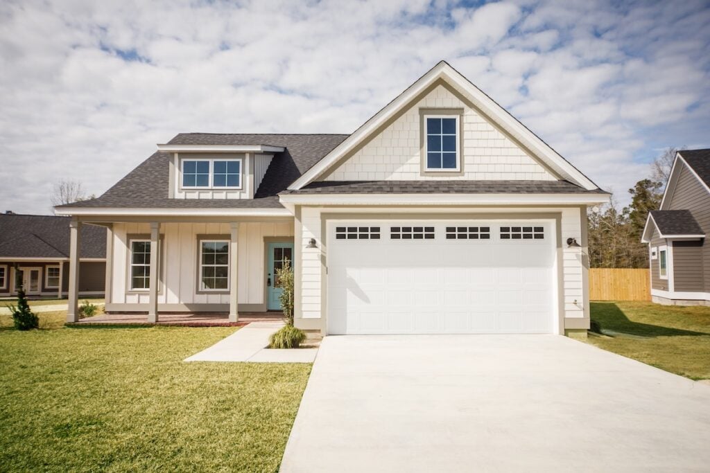 Modern new construction home with white siding