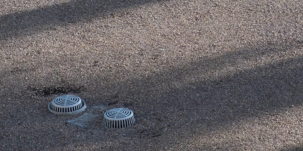 Flat building roof top with drain