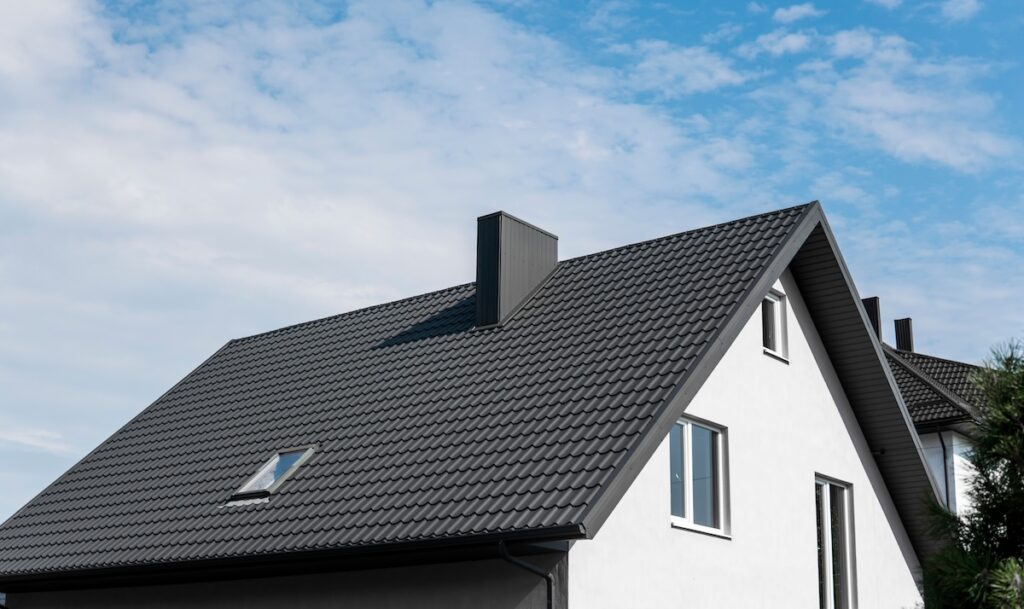 Modern black roof covered with tile effect PVC coated